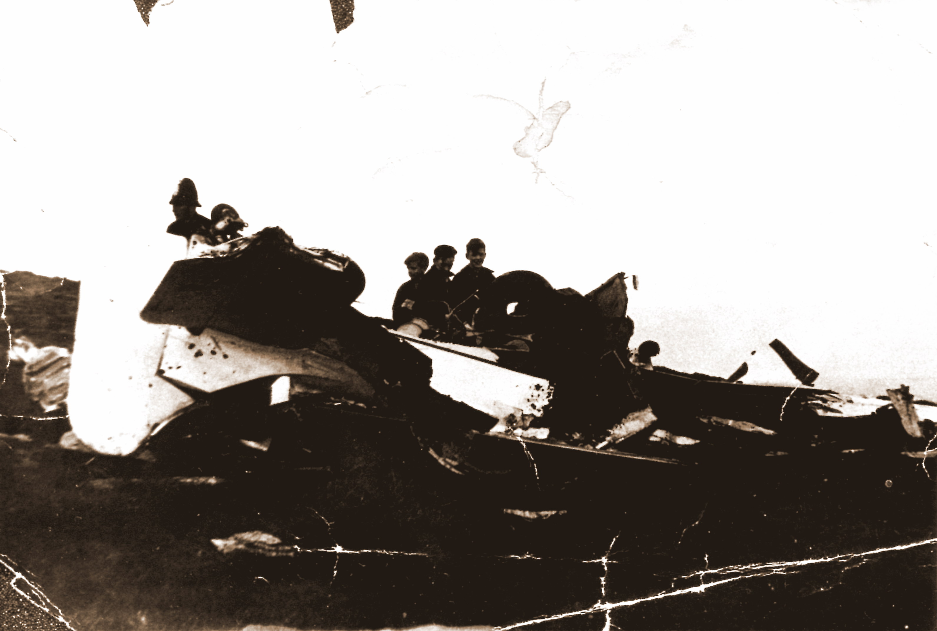 Only known picture of Miles Hawk crash on Kinder Low End. Two of the three boys in the picture are Robin (left) and Barry Capstick, sons of Stanley and Betty Capstick of Farlands. Stanley was head gamekeeper at the Kinder estate for many years. Copyright